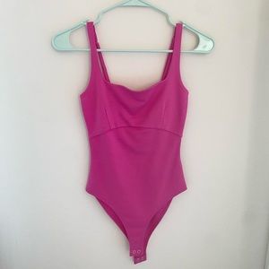 Hot pink body suit